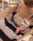 STRIPE SHEEPSKIN SNUGGLER - half moon
