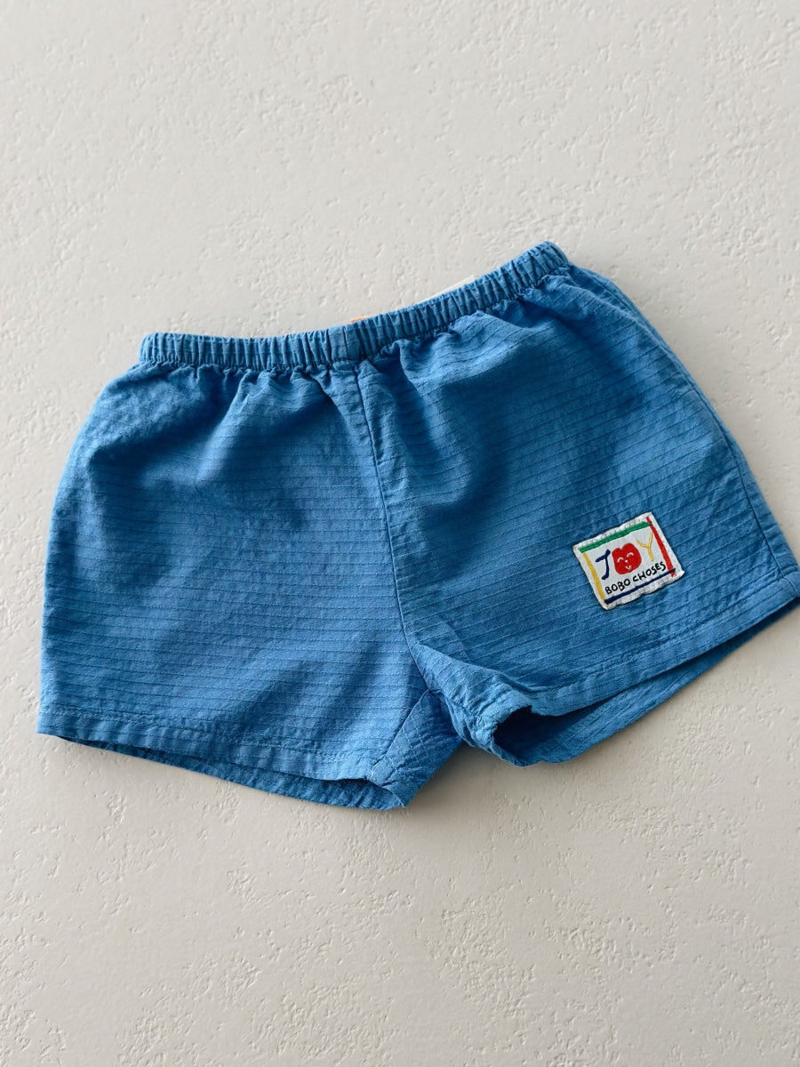 Smiling woven shorts - baby